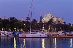 Palma cathedral from the harbour at dus k