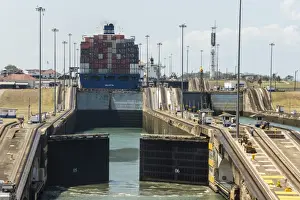 Panama Prints: Panamax-sized container ship goiing up through Gatun Locks on Panama Canal, Panama