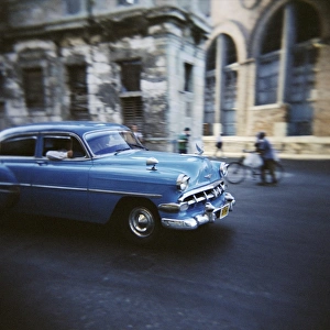Motoring Prints: Panned shot of an old blue American car, Havana, Cuba, West Indies, Central America