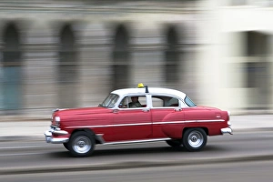 Vintage Car Prints: Panned shot of vintage American car on The Malecon