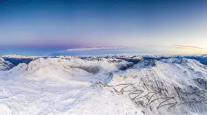 Mountain Pass Prints: Pano by drone of sunrise over the narrow bends of Stelvio Pass mountain road covered