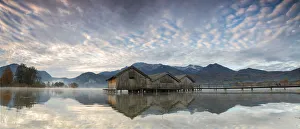 Panorama of Kochelsee framed by pink clouds at sunset, Schlehdorf, Bavaria, Germany