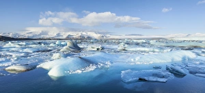 Blue Ice Prints: Panorama of mountains and icebergs locked in the frozen water, Jokulsarlon Iceberg Lagoon