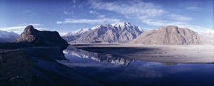 Barren Prints: Panorama of mountains reflected in the water of the Indus River