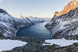 Panorama of peaks of the Ornfjorden framing the village of Fjordgard and Mount Segla in background
