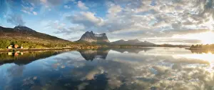 Midnight Sun Prints: Panorama of pink clouds reflected in the clear blue sea at midnight sun, Anepollen Fjord