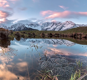 Soglio Prints: Panorama of pink clouds reflected in water at dawn, Tombal, Soglio, Bregaglia Valley
