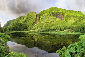 Pure Prints: Panorama shot of Poco da Ribeira do Ferreiro lake and waterfall with a side of the mountains covered by flowers