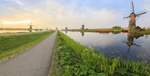 The Netherlands Prints: Panorama of the typical windmills reflected in the canals at dawn, Kinderdijk, UNESCO