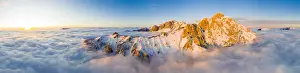 Lake Como Prints: Panoramic aerial view of Grigne group mountain peaks emerging from mist at sunset