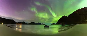 Lofoten Islands Prints: Panoramic of the frozen Haukland beach under a multicolored sky with Aurora Borealis (Northern Lights)