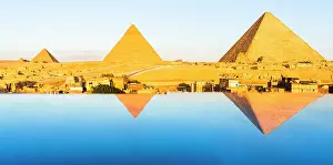 Pyramid Prints: Panoramic of the Giza pyramid complex and The Sphinx reflected in water at dawn