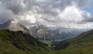 Grindelwald Prints: Panoramic of green valley surrounding Grindelwald and Bernese Alps lit by rainbow, First