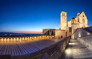 Umbria Prints: Panoramic of the illuminated arcade and Basilica di San Francesco during blue hour