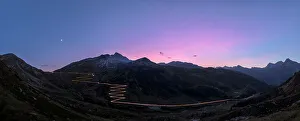 Night Sky Prints: Panoramic of lights of car traces at sunset, Spluga Pass, Chiavenna Valley, Switzerland