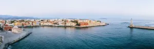 Chania Prints: Panoramic of the old Venetian harbour and lighthouse of Chania at sunrise, aerial view