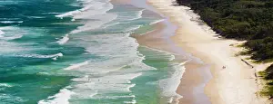 Australian Travel Prints: Panoramic photo of surfers heading out to surf on Tallow Beach at Cape Byron Bay