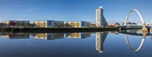Apartment Building Prints: Panoramic reflection of Clyde Arc (Squinty Bridge) and flats, River Clyde, Glasgow