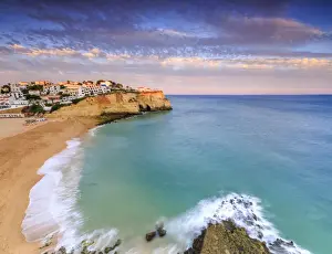 Lagoa Municipality Prints: Panoramic view of Carvoeiro village surrounded by sandy beach and clear sea at sunset