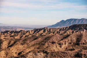 Granada Prints: Panoramic view across Desierto de Gorafes with ravines and mountain landscape in Granada