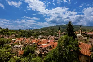 Minarets Prints: Panoramic view of Jajce showing red-roofed houses