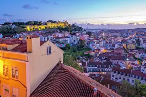 Alfama Prints: Panoramic view of Lisbon Castle from Miradouro da Senhora do Monte scenic point at dusk in the Alfama District