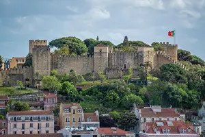 Alfama Prints: Panoramic view of Lisbon Castle from Miradouro da Senhora do Monte scenic point on a sunny day in the Alfama District