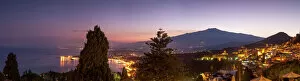 Typically Italian Gallery: Panoramic view of Mount Etna and Giardini Naxos at dusk from Taormina, Sicily, Italy
