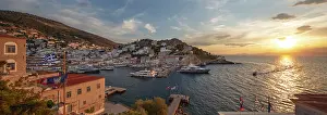 Locals Prints: Panoramic view over the port and whitewashed houses on hillside at sunset