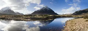 Panoramic view across River Etive towards snow-covered mountains including Buachaille Etive Mor