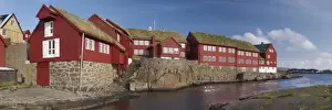Panoramic view of traditional turf-roofed government buildings on Tinganes peninsula