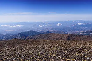 Granada Prints: Panoramic view from the upper slopes of Sierra Nevada National Park with clear skies over the plateau in southern Spain