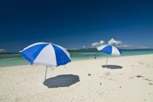 Images Dated 25th August 2008: Parasols at the beautiful beach in Nosy Iranja, a little island near Nosy Be