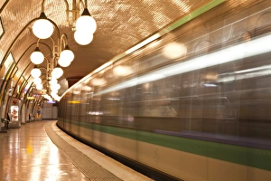 Lamp Prints: A Paris metro train leaves Cite station, Paris, France, Europe