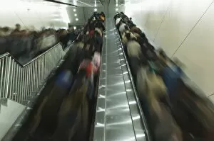 Passengers on moving escalators on the Beijing subway, Beijing, China, Asia
