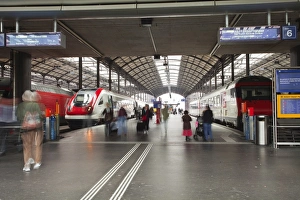 Railway Station Prints: Passengers rushing through Lucerne railway station, Lucerne, Switzerland, Europe