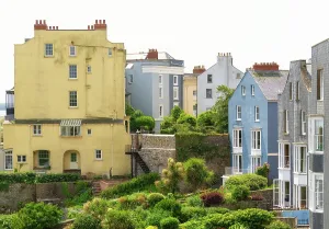 Facades Prints: Pastel buildings in Tenby, Pembrokeshire display unique architecture in a coastal setting