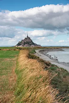 Grassland Prints: Path through grass leads toward Mont Saint-Michel in Normandy