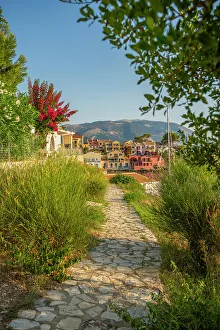 Kefalonia Prints: Path leading to harbour and colourful houses in Assos