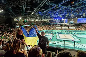 Sportsmanship Prints: Patriotic Ukrainian men cheering on men's gymnastics at the Paris 2024 Olympics