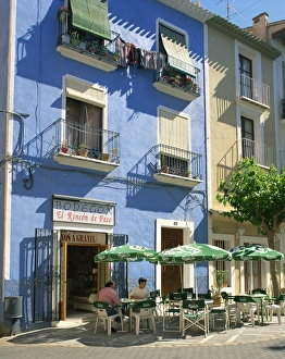 Pavement cafe in front of a blue painted building in Villajoyosa