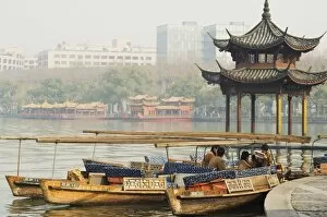 A pavillion on the waters edge of West Lake, Hangzhou, Zhejiang Province, China, Asia
