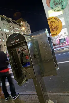 Images Dated 6th December 2009: Pay phone and shop windows on Fifth Avenue at night, Manhattan, New York City