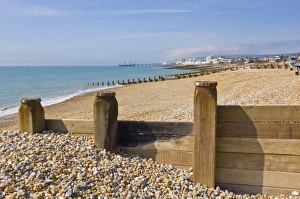 Pebble Beach Prints: Pebble beach and groynes, Eastbourne Pier in the distance, Eastbourne, East Sussex