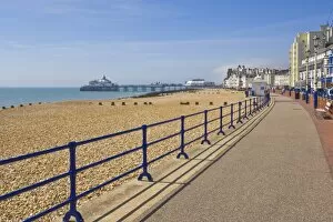 Images Dated 22nd May 2010: Pebble beach and groynes, hotels on the seafront promenade, Eastbourne pier in the distance