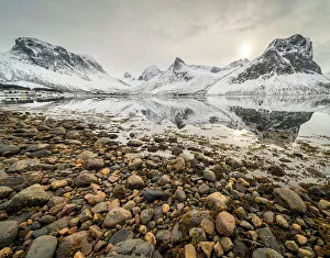 Reflective Prints: Pebbles and mountain reflections in fjord