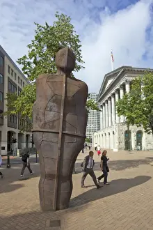 Metal Prints: Pedestrians pass the Iron Man sculpture by Antony Gormley 1993 in Victoria Square
