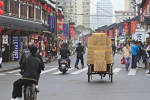 Pedestrians and traffic on Shanghai Old Street, a restored traditional neighbourhood, Nanshi, Shanghai, China, Asia