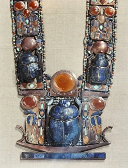 Beetle Prints: Pendant in the form of a boat showing a scarab, the symbol of the gods resurrection