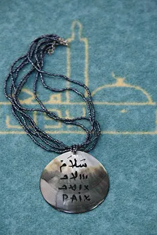 Lyon Prints: Pendant inscribed with peace in Arabic and French, Lyon, Rhone, France, Europe